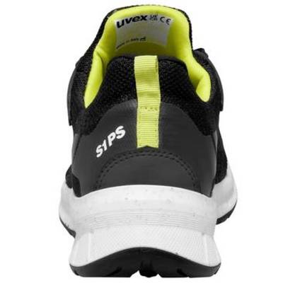 Vista posteriore di una scarpa di sicurezza atletica nera e giallo neon con marchio 'uvex' e 'S1PS' su una suola bianca.