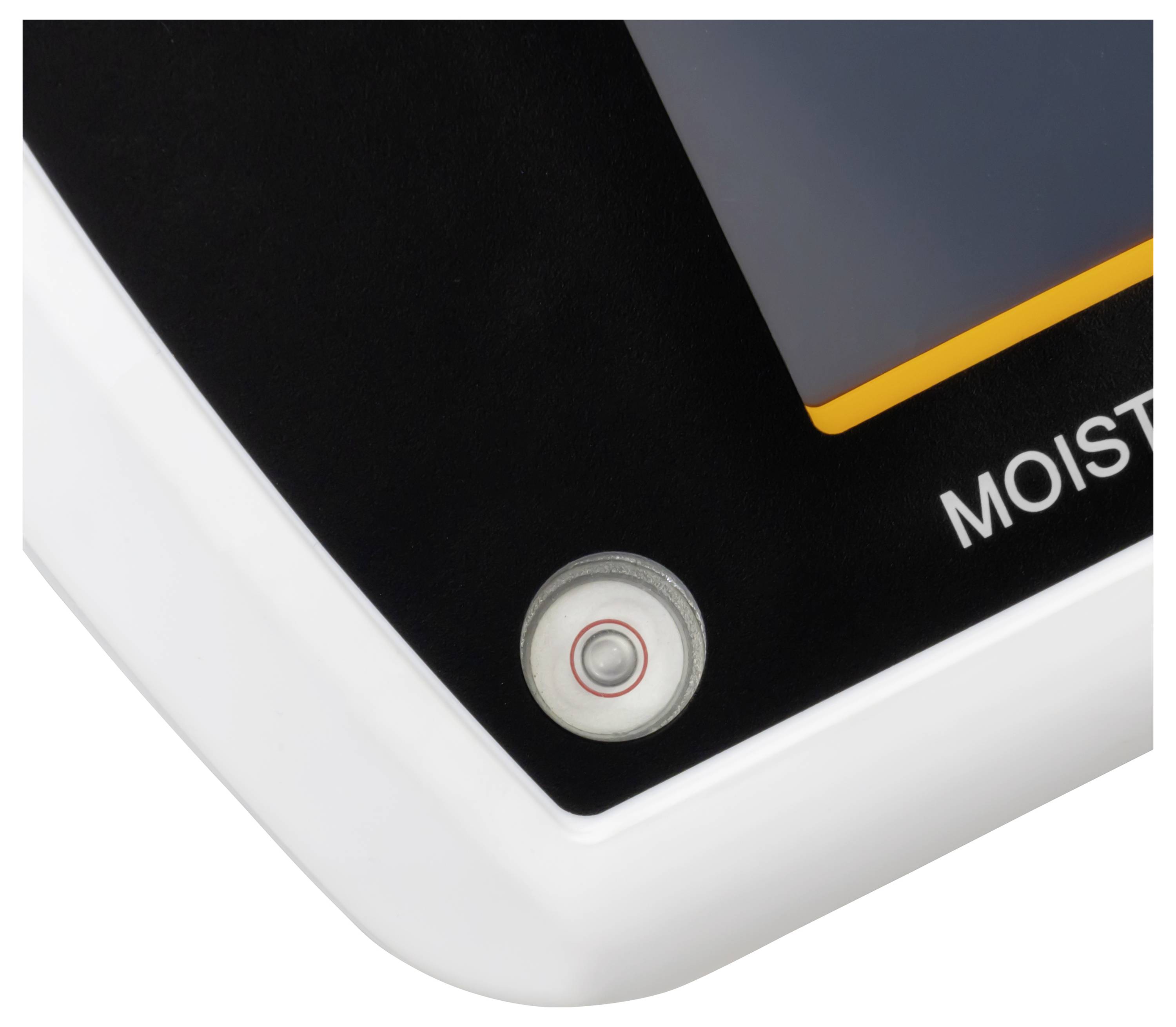 Primo piano di uno spigolo del dispositivo con un pulsante circolare o sensore e l'etichetta parziale "MOIST" su un pannello in bianco e nero.