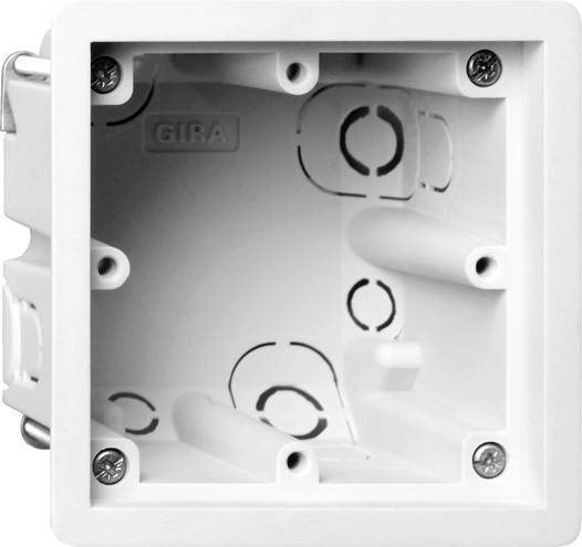 Scatola di plastica bianca per installazione elettrica da parete con fori per viti e aperture di montaggio, ripresa in primo piano su sfondo neutro.