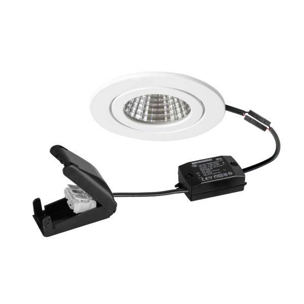 Kit di faretti LED incassati con cornice bianca, scatola driver nera e clip a molla su sfondo bianco.