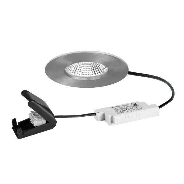 Kit di faretto LED da incasso con cornice rotonda argento, scatola driver bianca e clip a molla nera collegati da un cavo.