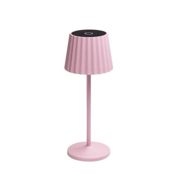 Lampada da tavolo senza fili di colore rosa con paralume pieghettato e base rotonda su sfondo bianco
