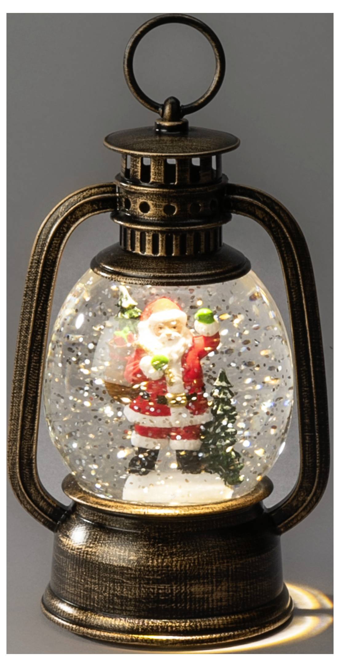 Lanterna natalizia con una figurina di Babbo Natale all'interno di una palla di neve, che brilla con una luce calda e neve scintillante.