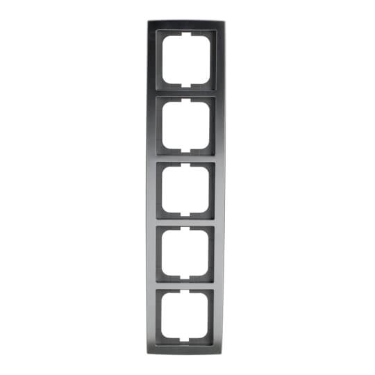 Piastra murale nera verticale con cinque fori rettangolari impilati per interruttori o prese.
