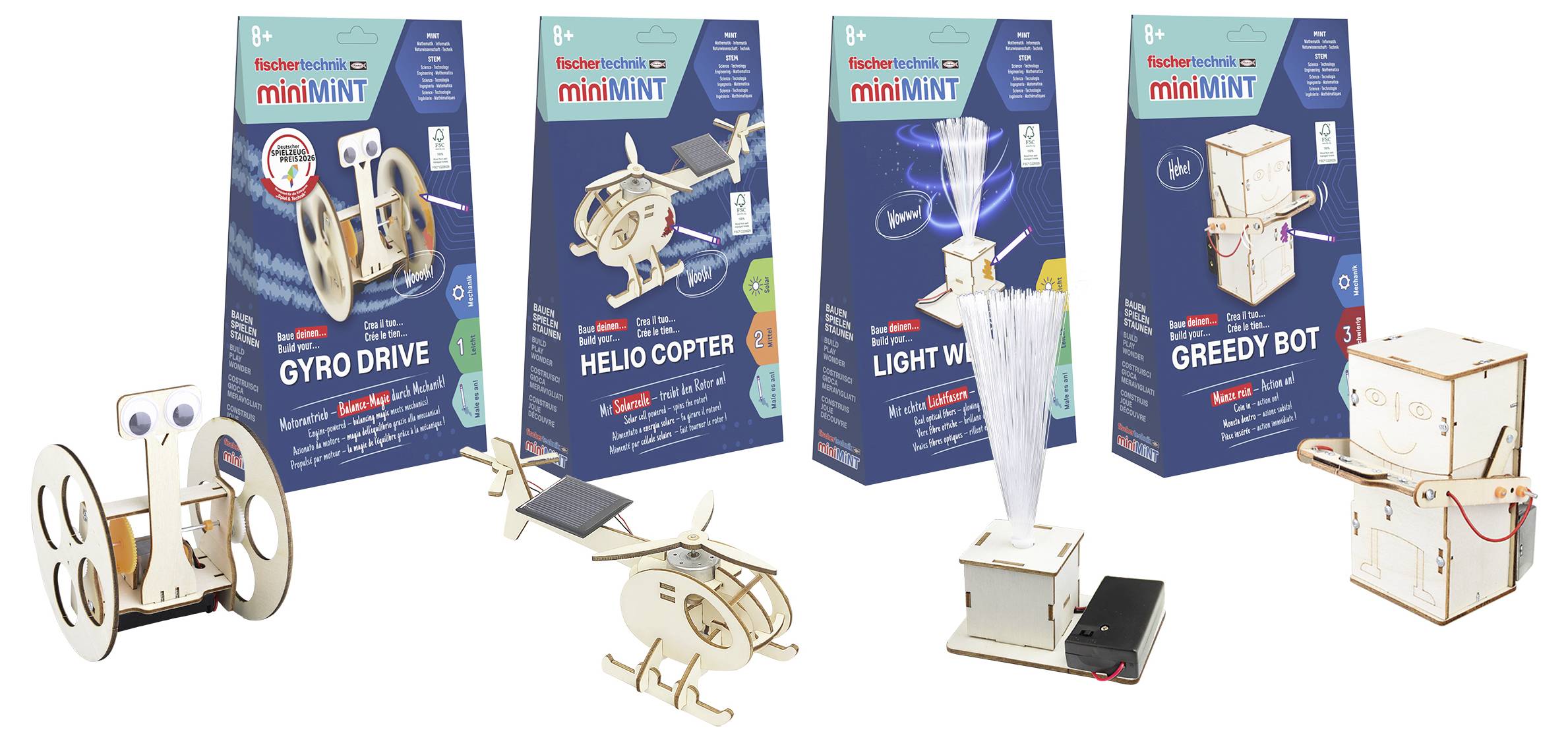 Quattro kit di mini robot da costruzione sono mostrati: Gyro Drive, Helio Copter, Light Wind e Greedy Bot, ciascuno con il suo modello assemblato esposto davanti alla scatola.