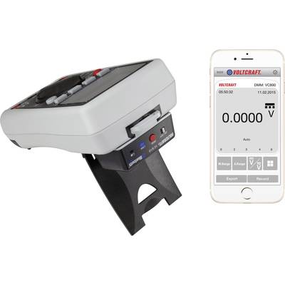Multimetro digitale con supporto, ripreso di lato. Accanto uno smartphone con l'app Voltcraft aperta, che mostra una tensione di 0,0000 V.
