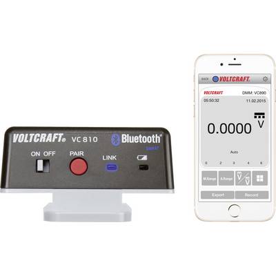 Un adattatore Bluetooth 'Voltcraft VC 810' accanto a uno smartphone con l'app 'Voltcraft' aperta per la connessione e la visualizzazione dei dati di misurazione.