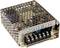 Involucro metallico di un alimentatore switching con fori di ventilazione. La parte anteriore mostra morsetti di connessione e etichette per tensioni e regolazioni.