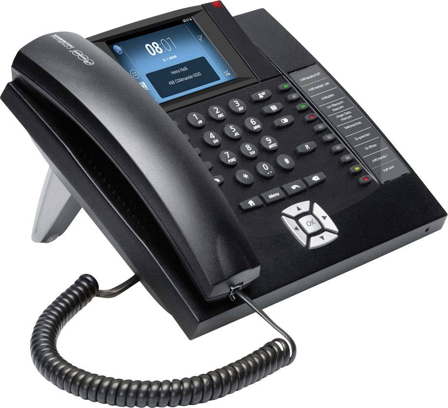 Un telefono da ufficio moderno con un ampio display, tastiera numerica, tasti funzione e cornetta posizionata su una base sottile. Ideale per ambienti professionali.