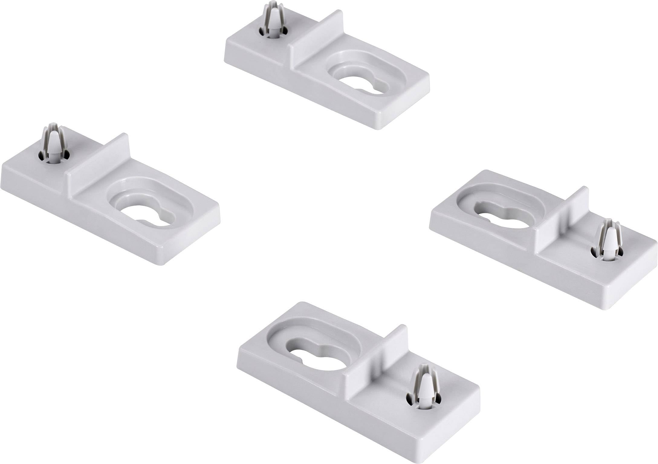 Quattro piedistalli bianchi in plastica con staffe di fissaggio, disposti simmetricamente. Sono utilizzati per fissare oggetti di forma tubolare.