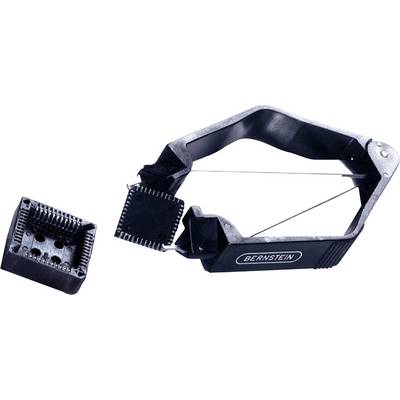 Un estrattore di chip di Bernstein tiene un microchip accanto a un alloggiamento vuoto. Dispositivo per la rimozione sicura di chip da schede elettroniche.