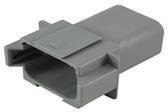 Connettore rettangolare grigio in plastica con più terminali, utilizzato per connessioni elettriche in applicazioni tecniche.