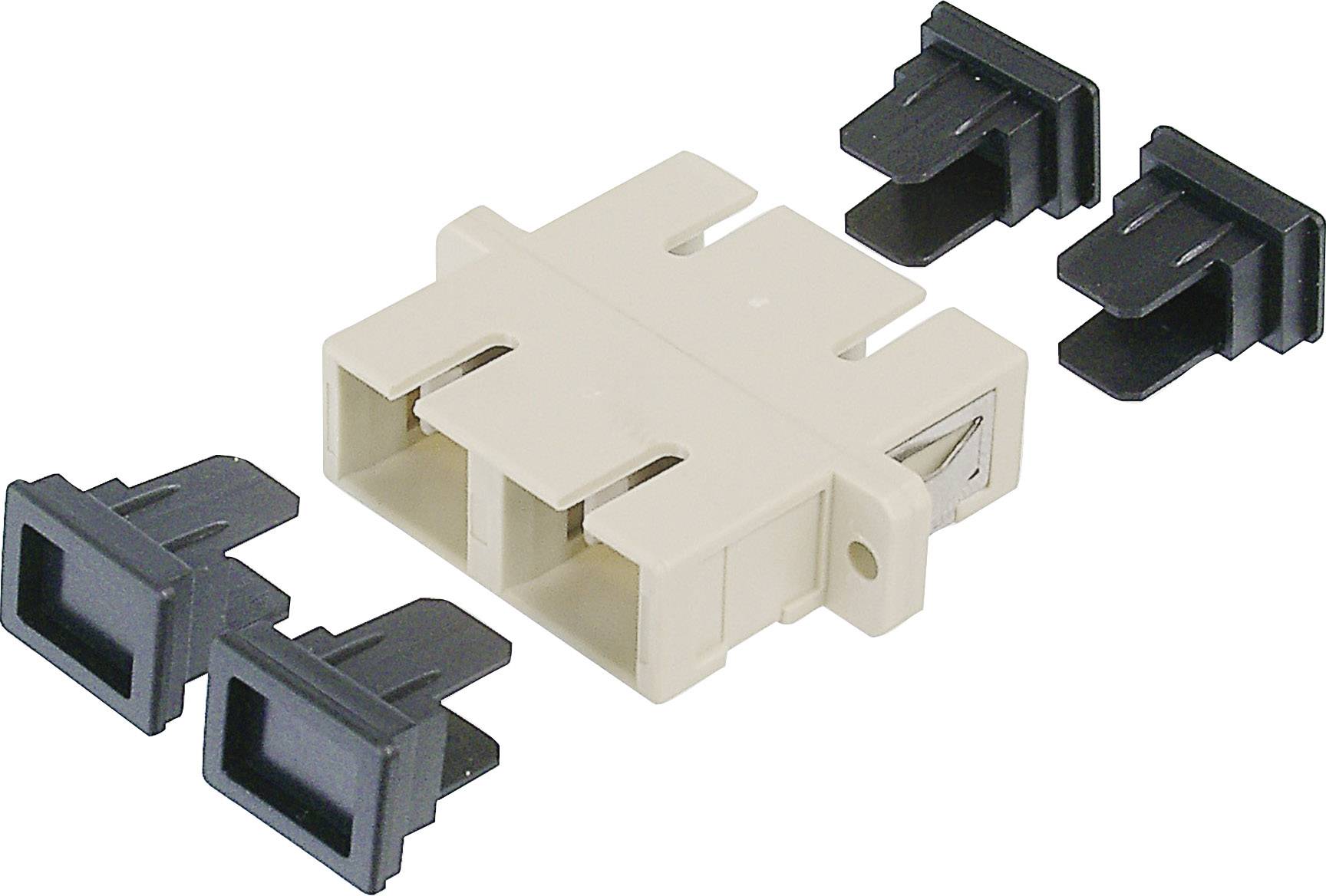 Un accoppiatore in fibra ottica beige con cappucci di copertura neri. L'accoppiatore dispone di due prese per l'utilizzo nelle reti.