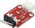 Un modulo sensore di urti rosso con tre connettori: OUT, VCC e GND, contrassegnato con 'IDUINO'.