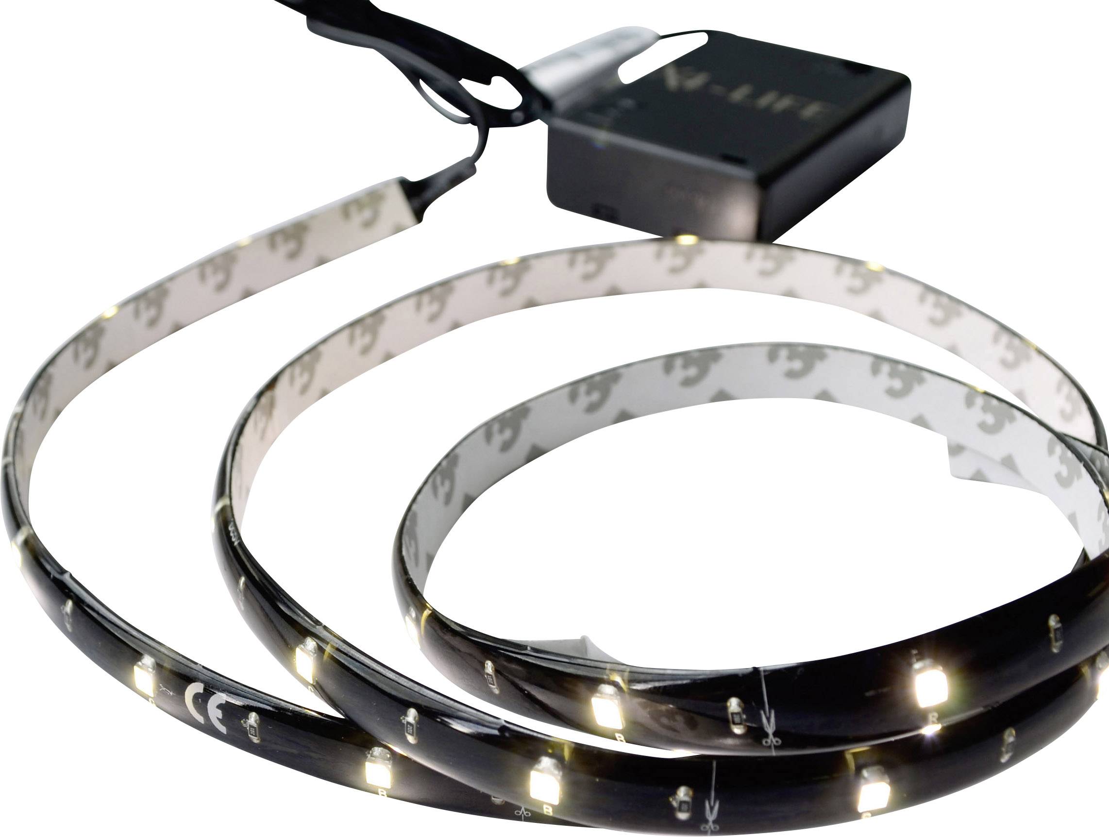 Una striscia LED arrotolata con LED illuminati, collegata a un modulo di controllo nero.