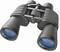 Binocolo con lenti blu in primo piano, ideale per attività all'aperto come birdwatching o escursioni.
