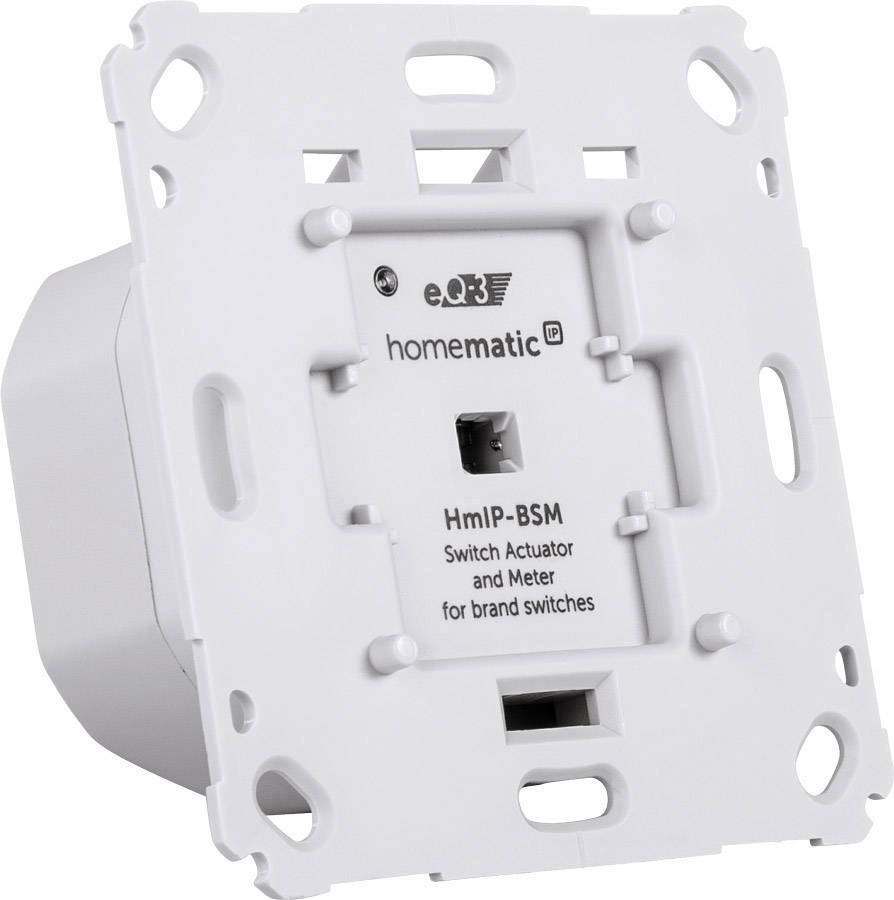 Un attuatore di commutazione Homematic IP HmIP-BSM bianco per interruttori di marca, raffigurato in prospettiva laterale.