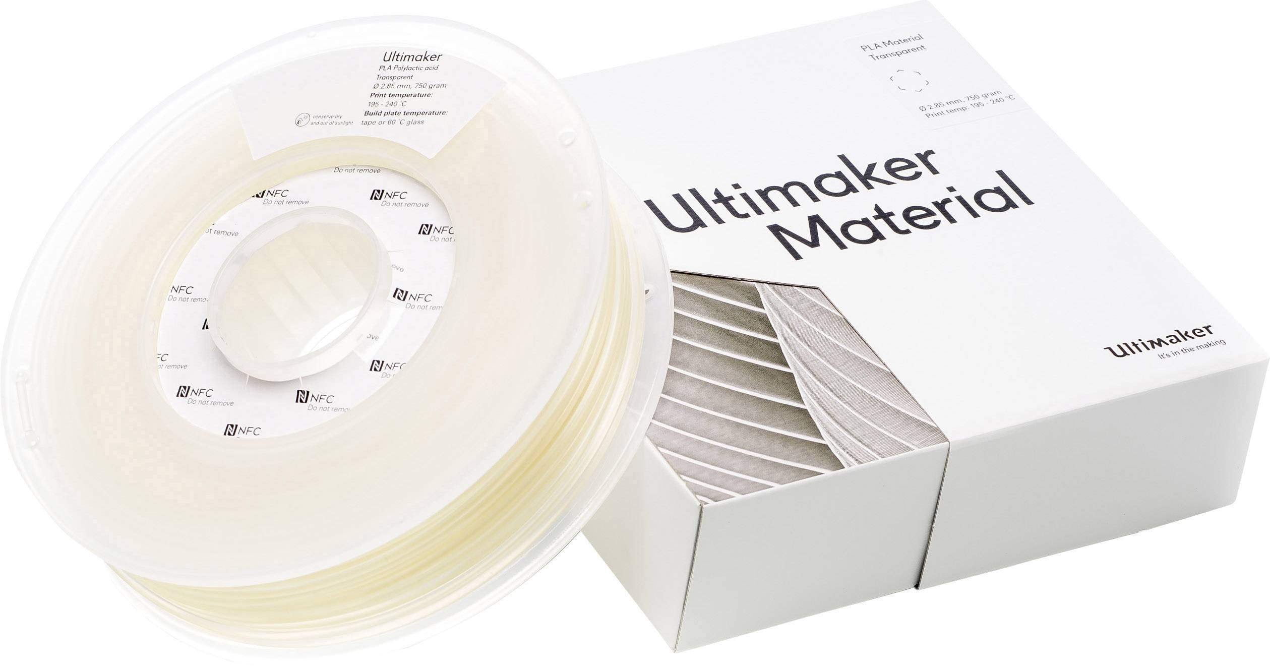 Un rotolo di filamento per stampanti 3D accanto a una scatola con la scritta 'Ultimaker Material'.