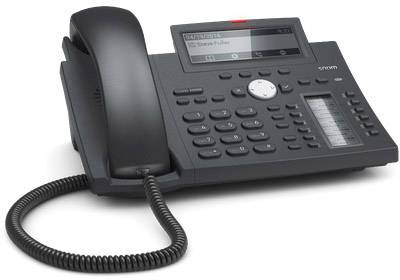 Un telefono da ufficio nero con display, altoparlante, tastiera e ricevitore sul lato sinistro. Il display mostra il testo 'Siemens Gigaset'.