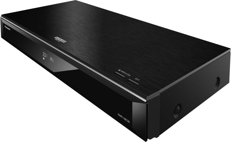 Un lettore Blu-ray nero è posizionato su un tavolo. Sul suo involucro sono visibili i loghi del marchio. Il design è sottile e moderno.