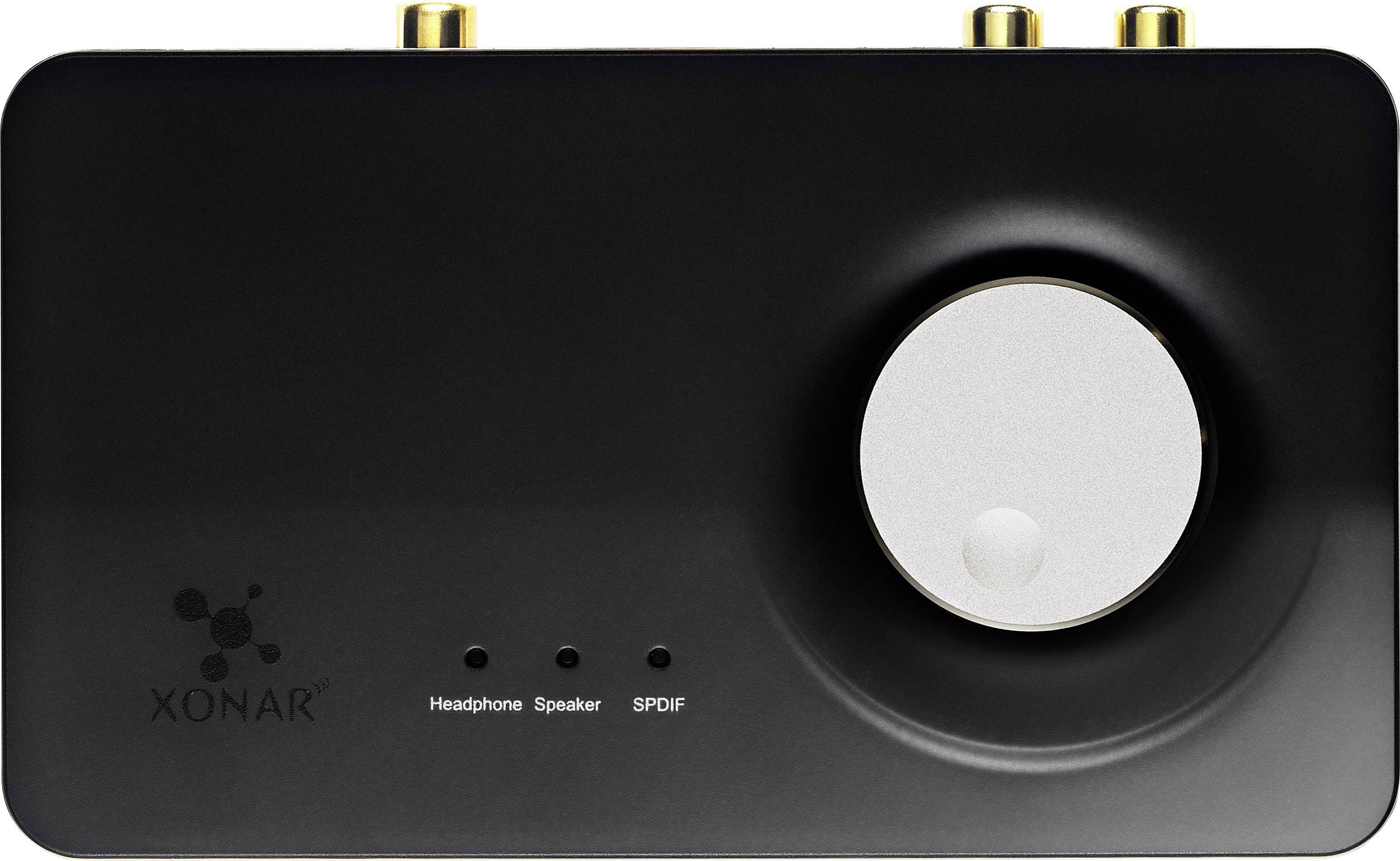 Scheda audio esterna nera con grande manopola del volume e etichette: 'Headphone', 'Speaker', 'SPDIF'. In alto due connettori dorati.