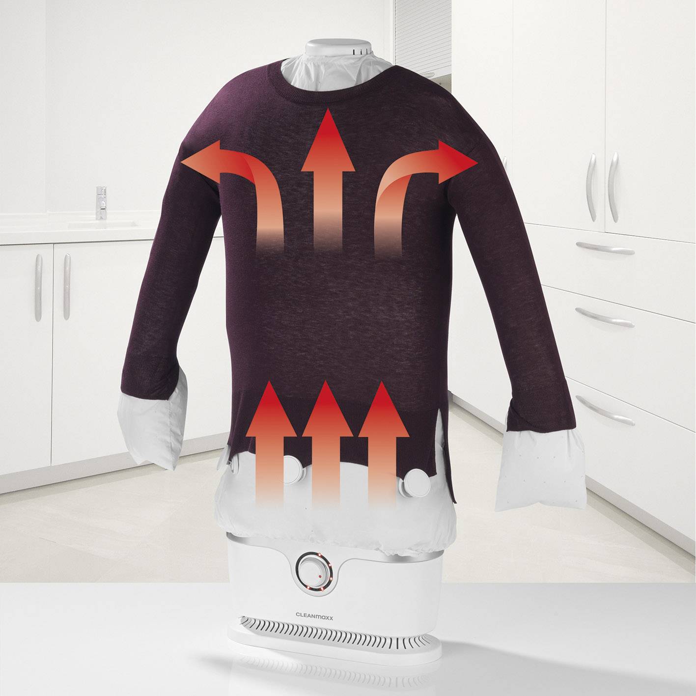 Un maglione viola viene asciugato su un'asciugatrice automatica. Frecce rosse mostrano l'aria calda che scorre attraverso il tessuto.