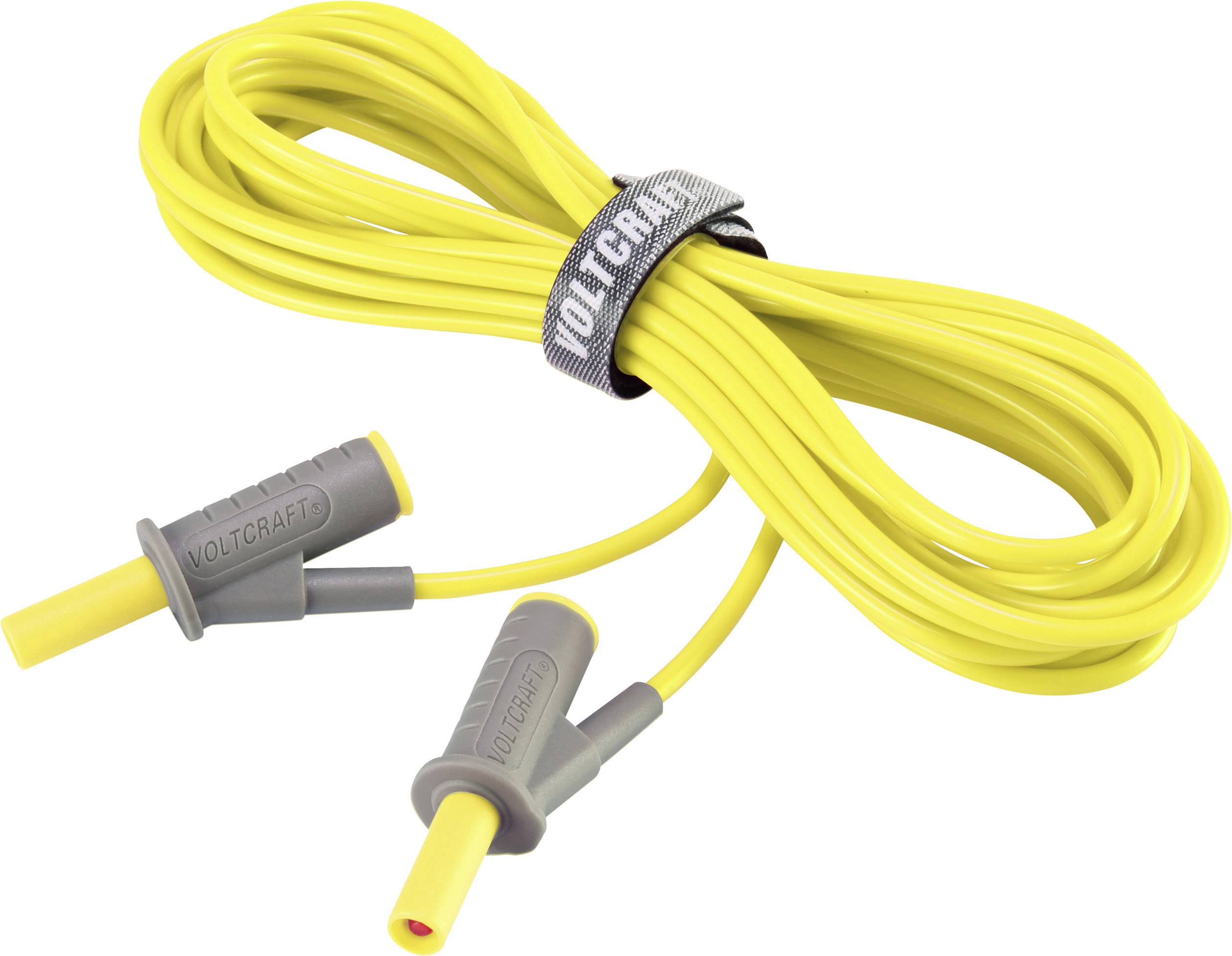 Cavo giallo con due spine grigie e la scritta 'Voltcraft' fermato da un fermacavo.