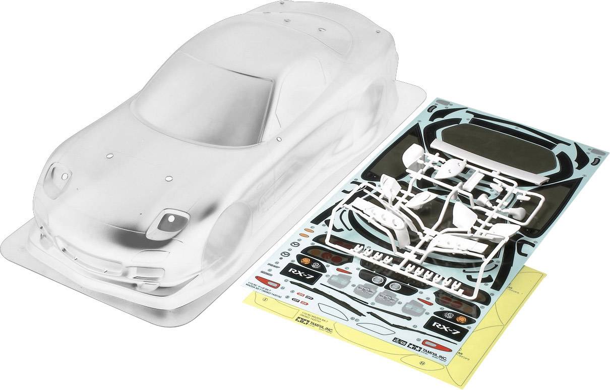 Un kit carrozzeria per modellino auto trasparente, completo di foglio decorativo e piccoli particolari, pronto per essere assemblato e personalizzato.