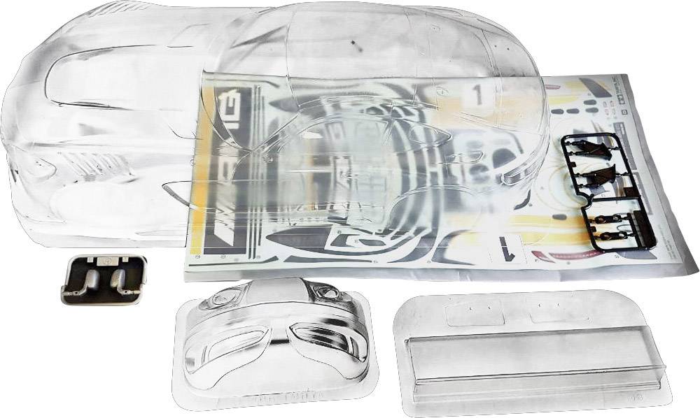 Un kit trasparente per un modellino di auto, composto da una carrozzeria, adesivi e parti singole, distribuiti su un tavolo.