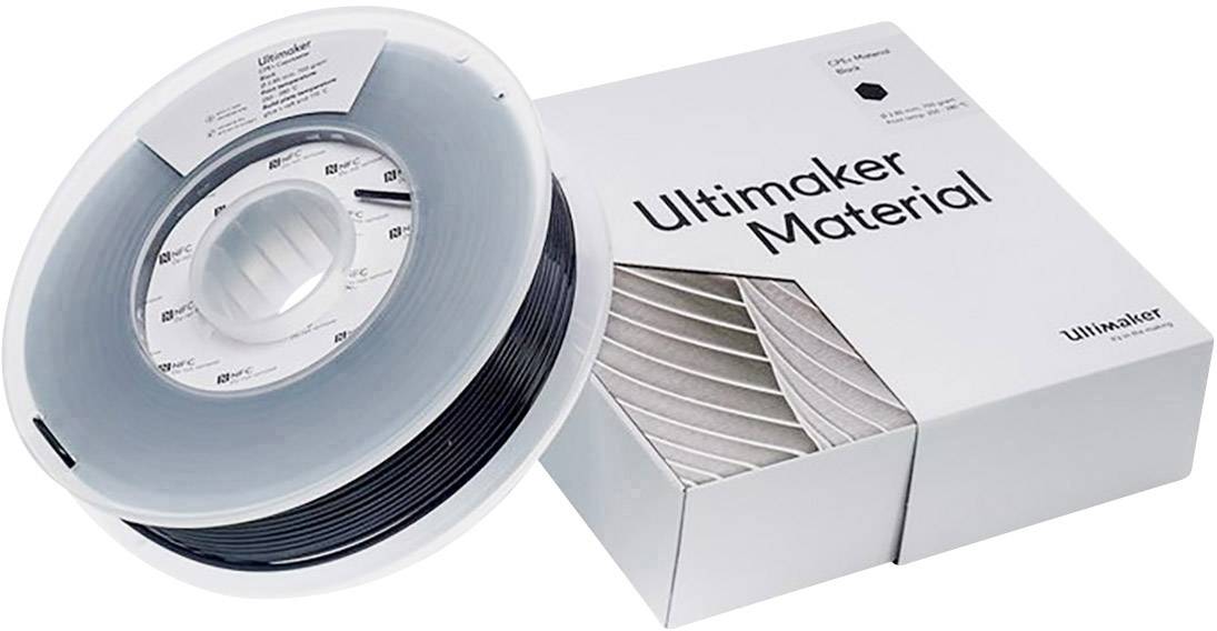 Bobina di filamento per stampa 3D di Ultimaker accanto a un imballaggio bianco etichettato con 'Ultimaker Material'.
