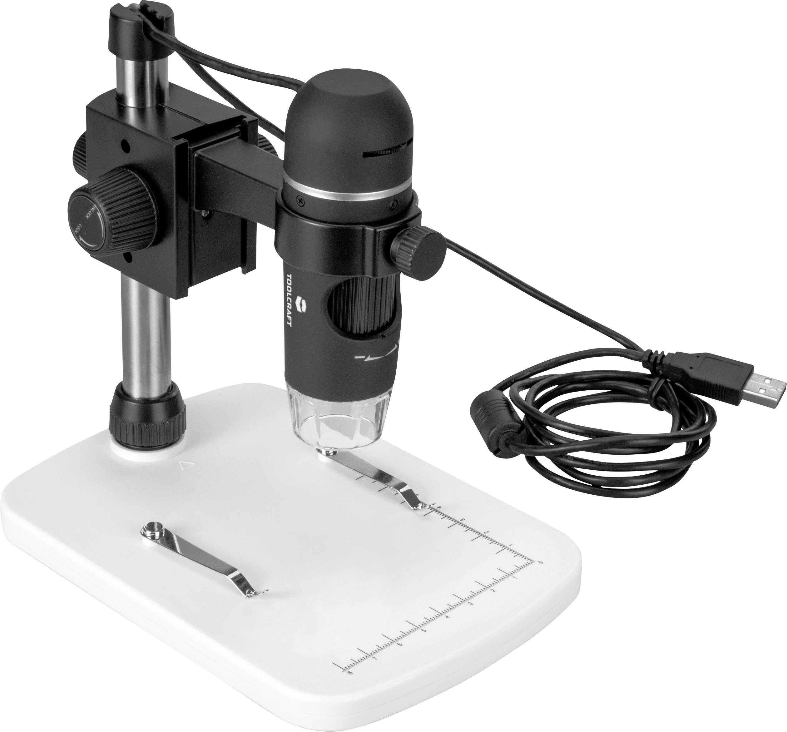 Microscopio digitale su una base bianca con marcature di riferimento, collegato tramite cavo USB.