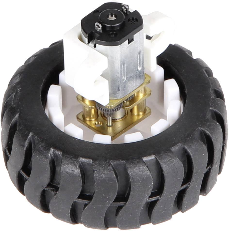 Primo piano di un piccolo motore con ingranaggio montato su una ruota, dotato di lamelle in gomma nera per il movimento in più direzioni.