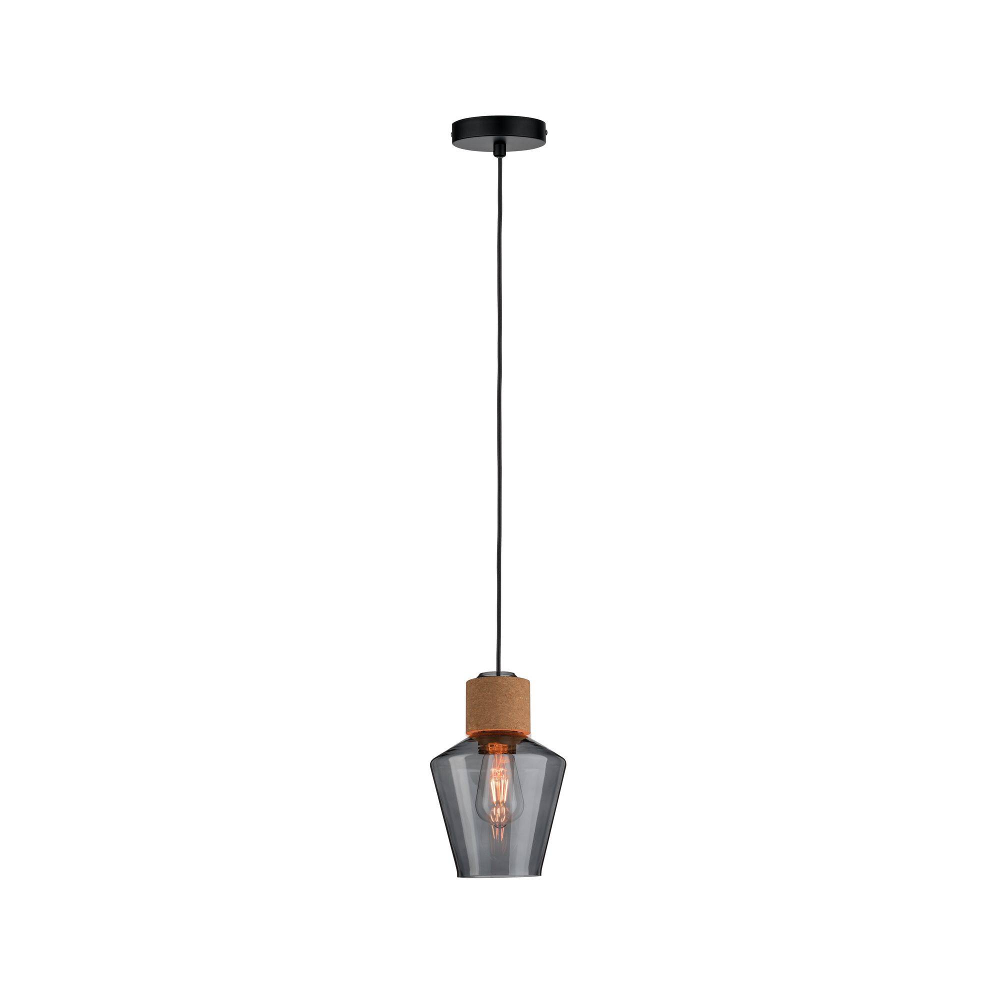 Una moderna lampada a sospensione con paralume nero e lampadina a vista pende dal soffitto.