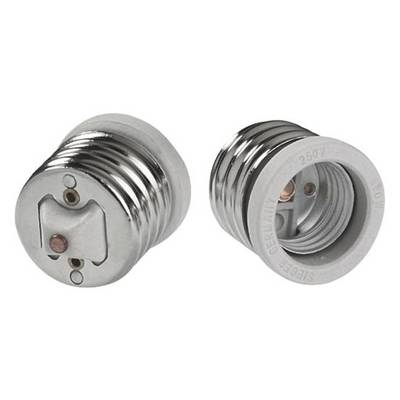 Due adattatori argentati con filettatura. Uno è visibile dall'alto, l'altro dal lato. Sono destinati a connessioni elettriche.