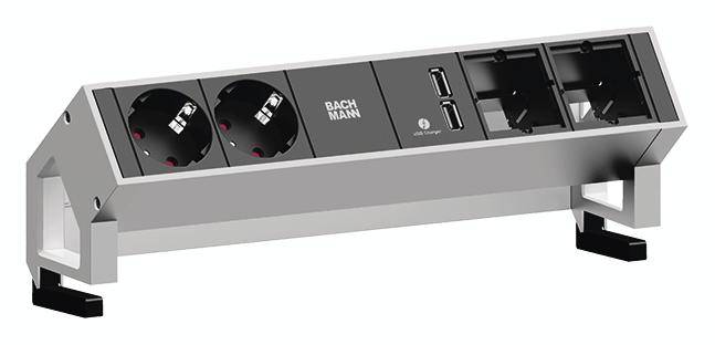 Un supporto da tavolo con due prese elettriche, due porte USB e due interruttori di rete in un involucro color argento.