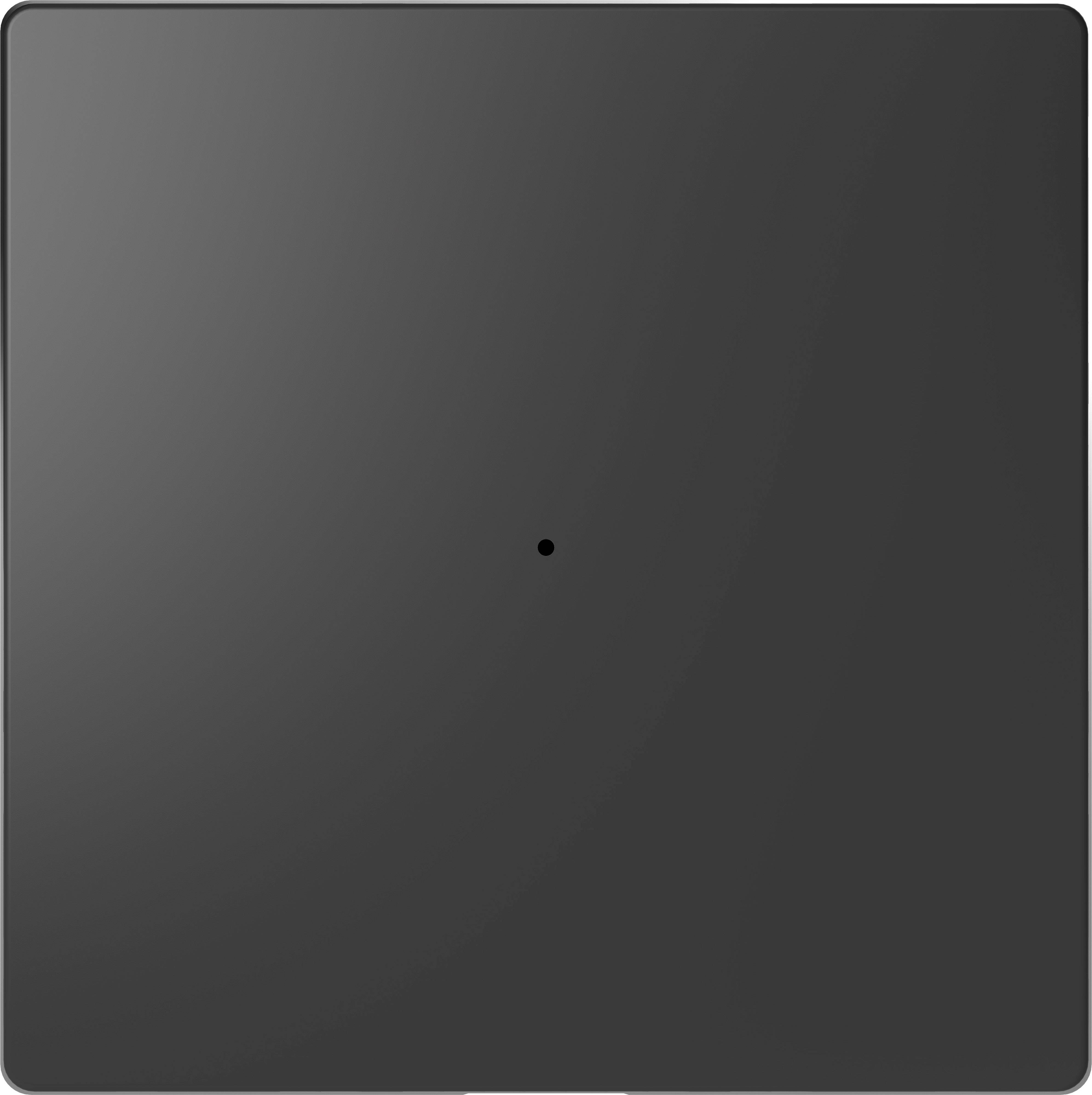 Un interruttore nero e quadrato con un piccolo tasto centrale, su uno sfondo grigio.