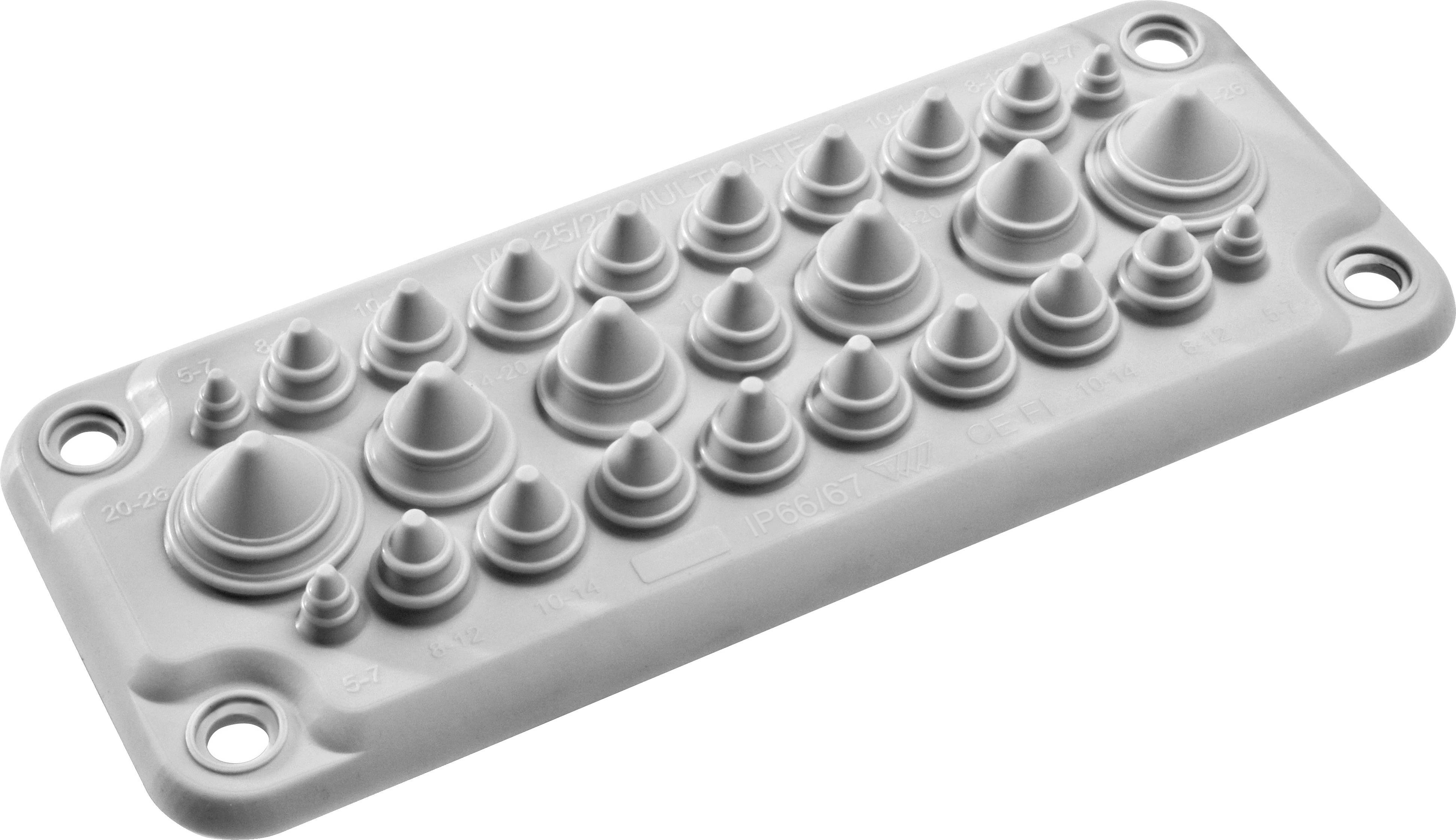 Un pezzo grigio in plastica con una serie di cupole e rilievi di diverse dimensioni e distanze.