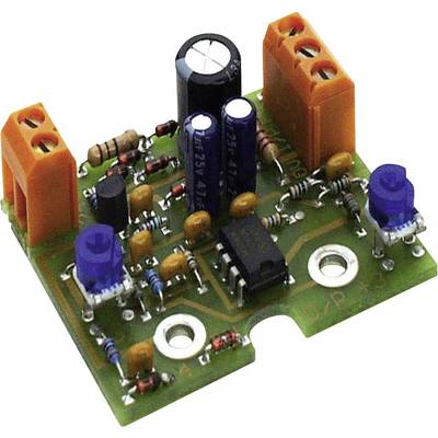 Una scheda verde con componenti elettronici come resistori, condensatori e un circuito integrato.