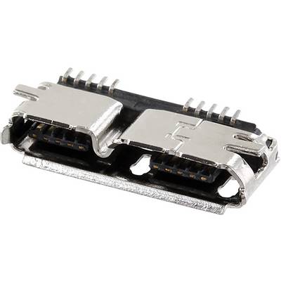 Connettore USB-C in primo piano. Custodia metallica color argento con elementi in plastica nera e piedini di contatto visibili.