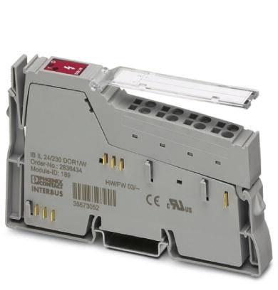 Un modulo elettronico grigio con più connettori e una parte di copertura trasparente, contrassegnato con dettagli tecnici.