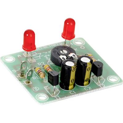 Un circuito elettronico verde con due LED rossi, resistenze e condensatori visibili su una scheda.