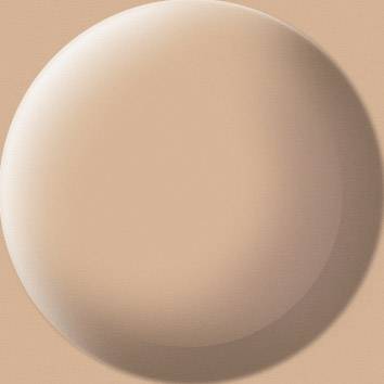 Un cerchio rotondo beige su uno sfondo più chiaro.