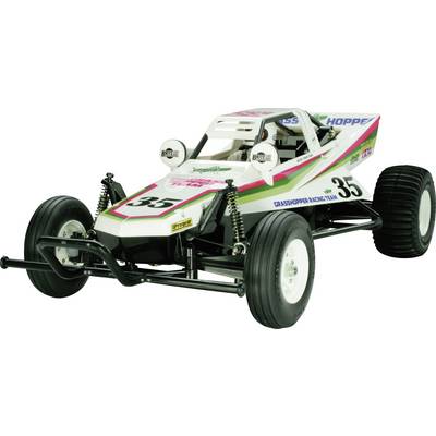 Un buggy bianco da modello con la scritta '35' sul lato, strisce verde-rosa, pneumatici robusti e ammortizzatori.