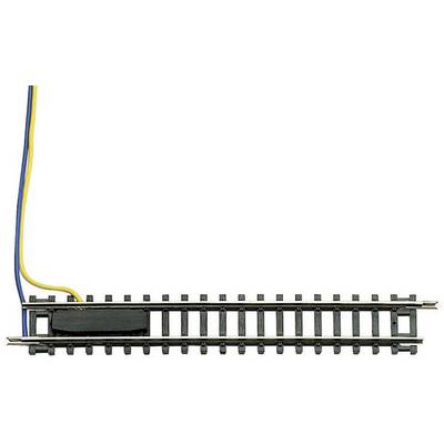 Un pezzo di binario per modellismo ferroviario con due cavi collegati sul lato sinistro, che indicano l'alimentazione o il controllo.