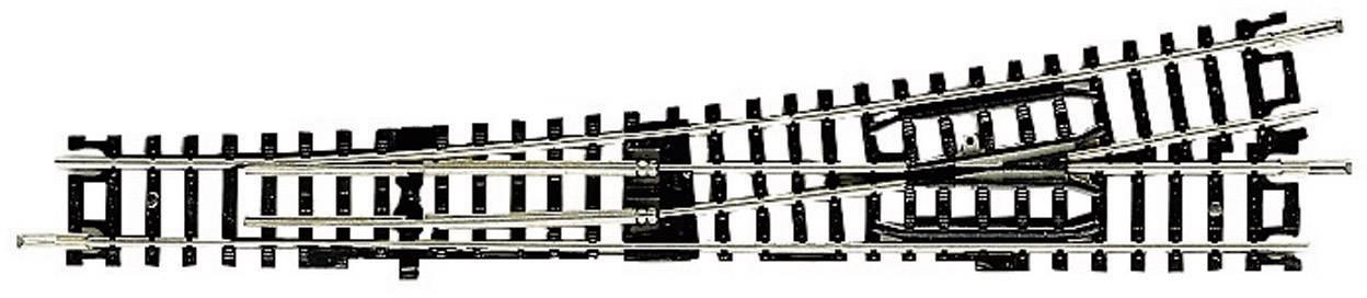 Deviazione ferroviaria in plastica nera e metallo. I binari si diramano in due direzioni per guidare i treni su percorsi differenti.