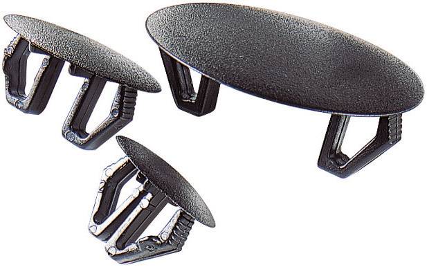 Tre pezzi di plastica nera di diverse dimensioni, presumibilmente tappi di chiusura con fermagli, sono disposti in modo obliquo.