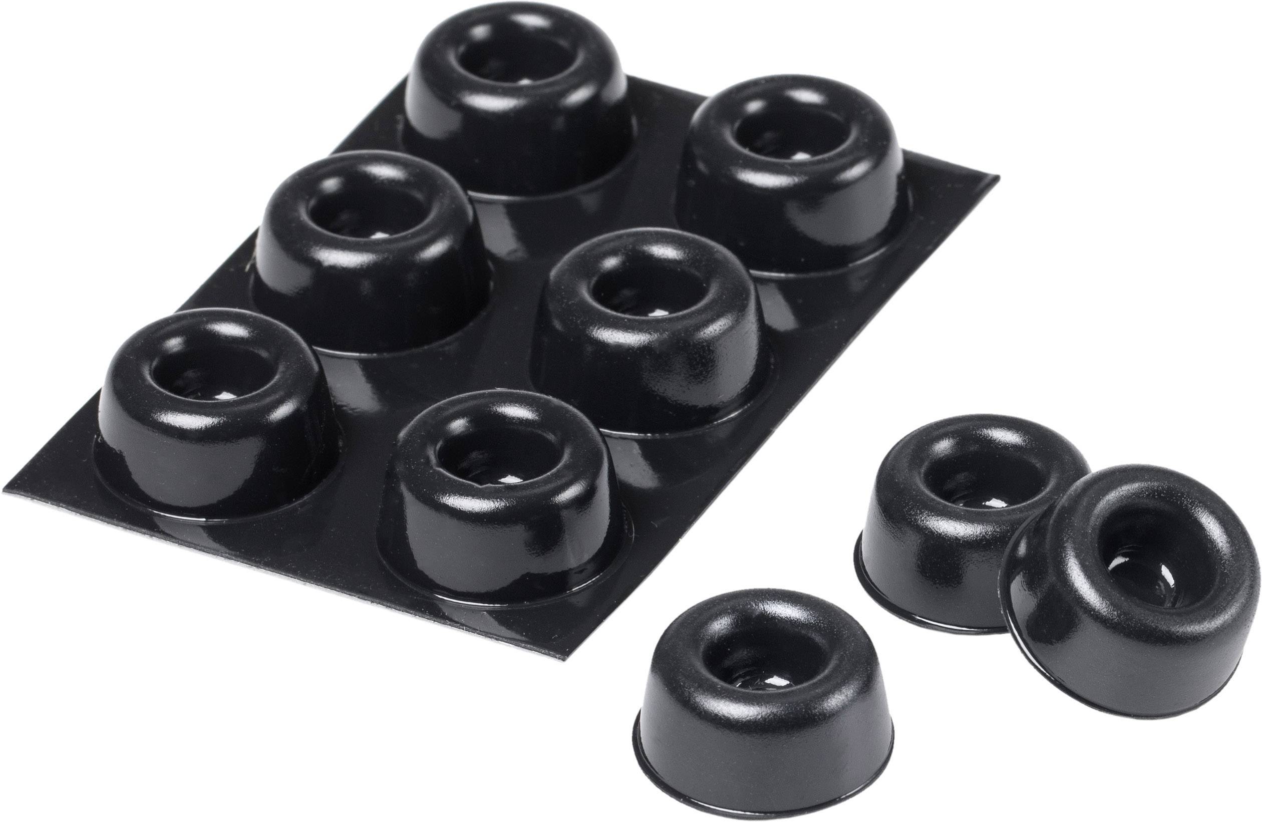 Piedini in gomma nera su un supporto e disposti liberamente accanto, per l'ammortizzazione o la stabilizzazione di dispositivi.