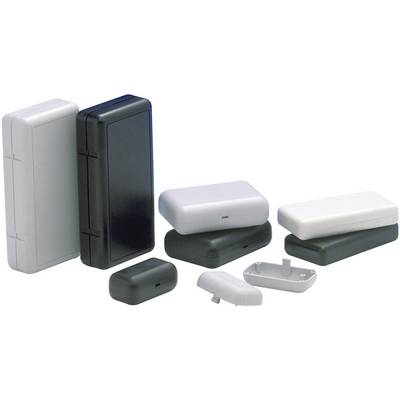 Vari contenitori rettangolari in plastica di colore nero e bianco, impilati o affiancati, parzialmente aperti, su sfondo bianco.
