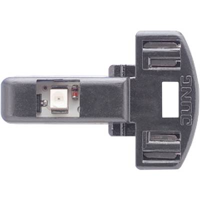 Un componente nero in plastica con un elemento elettronico integrato, probabilmente un sensore o un LED, contrassegnato con 'JUNG'.