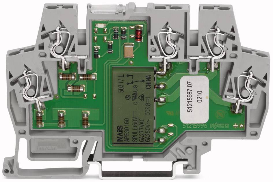Blocco terminale elettrico grigio con scheda elettronica verde e morsetti a vite, idoneo per applicazioni industriali e cablaggi.